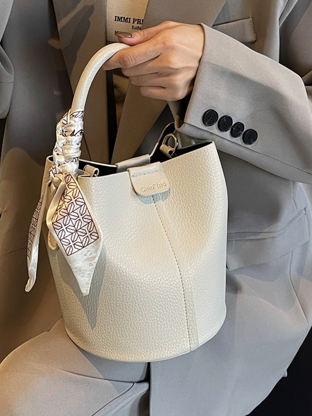 A Classy Chic Boutique Cream Textured Bucket Bag with Scarf Accent
